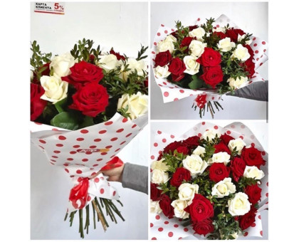 A bouquet of 25 red and white roses with boxwood!