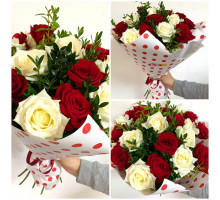 A bouquet of white and red roses, decorated with boxwood in a stylish craft package!