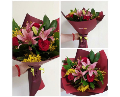 Bouquet of lilies, roses and mimosa in a stylish package!