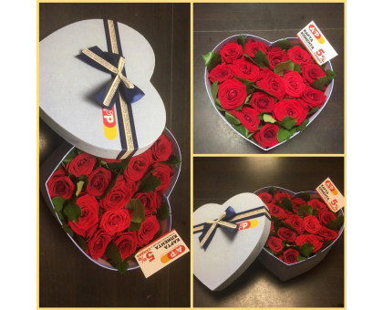 Red roses in a hat box in the shape of a heart!